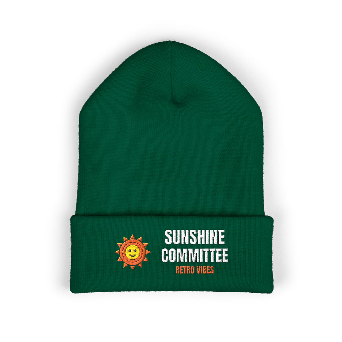 Sunshine Committee — the stepped sun badge, small over the left chest. Membership: show up for the good light, embroidered on a Yupoong cuffed knit beanie by Retro Vibes